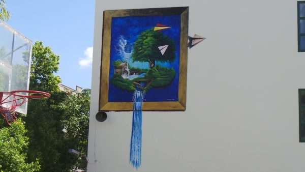 Sample work :A mural with the theme of a paper airplane dreams in a school setting